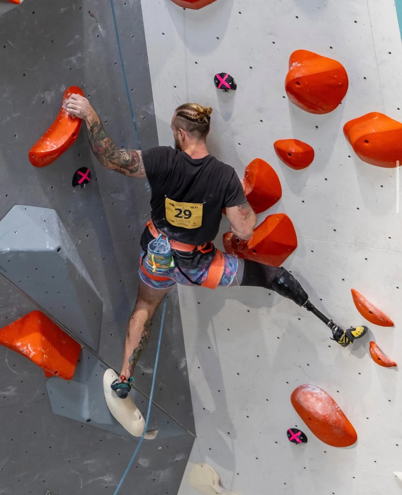 A brand ambassador climbing